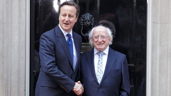 Prime Minister David Cameron and Irish President Michael D. Higgins shake hands in Downing Street.