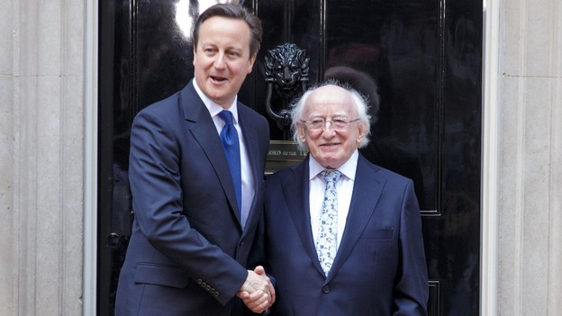 Prime Minister David Cameron and Irish President Michael D. Higgins shake hands in Downing Street.