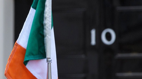 Ireland's flag seen atop the Irish president's car outside Number 10.