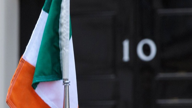 Ireland's flag seen atop the Irish president's car outside Number 10.