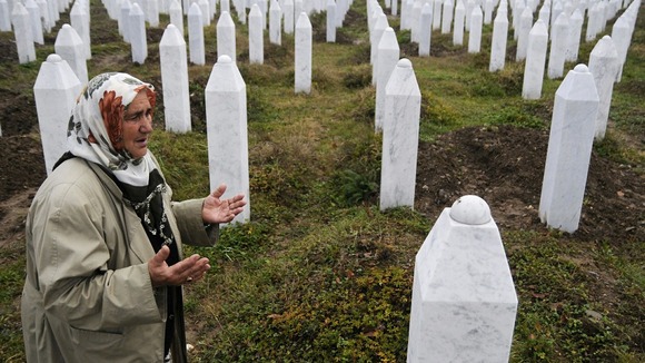 Bosnian Muslim, Suhra Malic, prays at the Memorial Center in Potocari in 2009