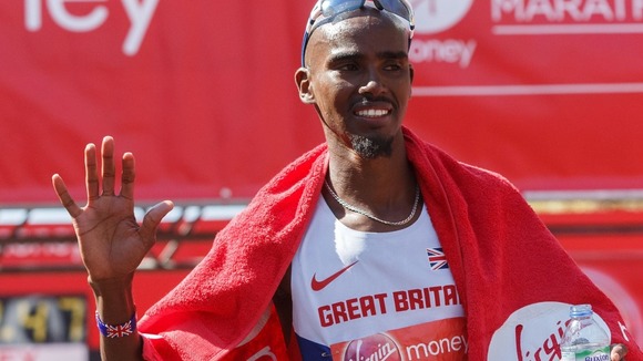 Mo Farah waves after finishing in eighth place at the London Marathon 2014.