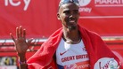 Mo Farah waves after finishing in eighth place at the London Marathon 2014.