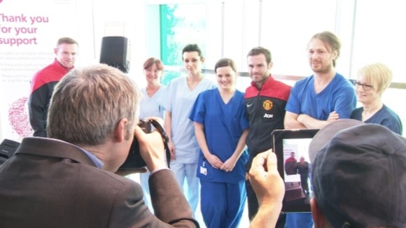 Staff meet footballers