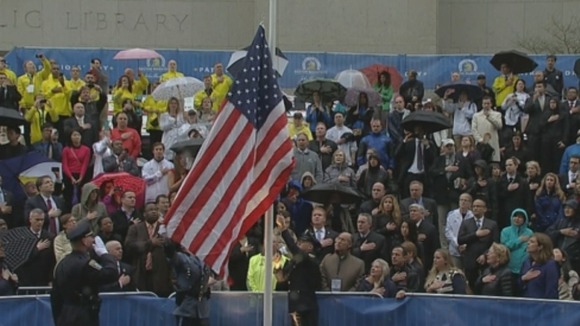 Following the minute's silence an American flag was unfurled as the crowd sang the National Anthem.
