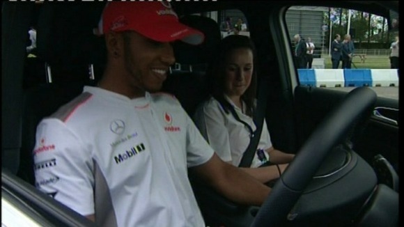 Lewis Hamilton giving safety tips to young drivers at Silverstone