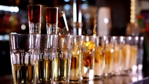 shot glasses lined up on bar