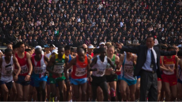 Briton Will Marks won a half-marathon in North Korea's capital Pyongyang, which was opened to foreigners for the first time