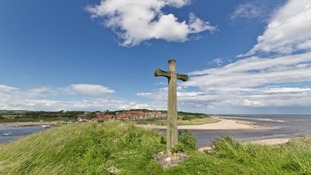 St Cuthbert's Cross, Alnmouth and the bay behind
