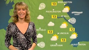 Emma Jesson in front of weather map