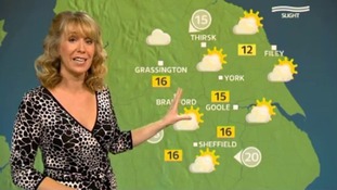 Emma Jesson in front of weather map