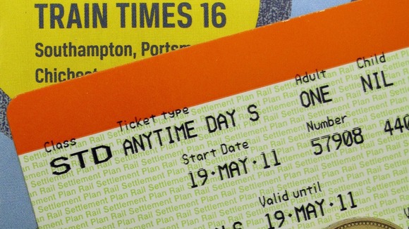 ile photo dated 19/05/11 of a train ticket, money and a railway timetable
