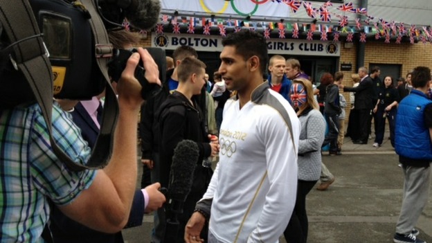 Amir Khan preparing to carry torch in Bolton