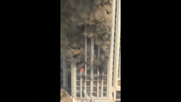 Firefighters tackle the blaze.