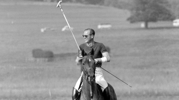 The Duke of Edinburgh, with his left arm bandaged, as he returned from polo practice at Cowdray Park in 1963