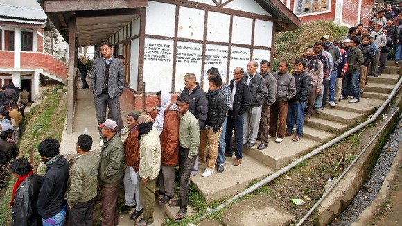 People stand in line to cast their votes at Bomdila town in the northeastern Indian state of Arunachal Pradesh