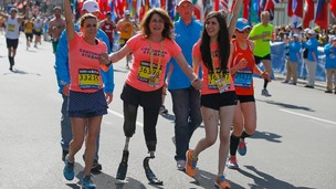 Celeste Corcoran (C) and her daughter Sydney (R) finish the race with Celeste's sister Carmen Acabbo.