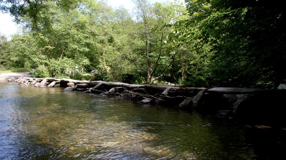 Tarr Steps is a prehistoric clapper bridge across the River Barle in the Exmoor National Park.