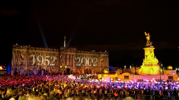 Coloured lights change the appearance of the facade of Buckingham Palace in London commemorate Britain's Queen Elizabeth's Golden Jubilee.