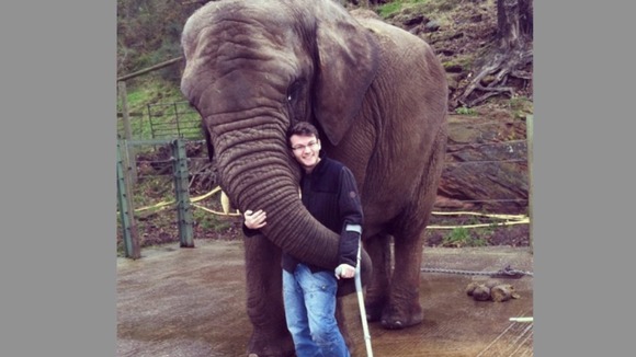 Stephen hugging a three and a half tonne elephant