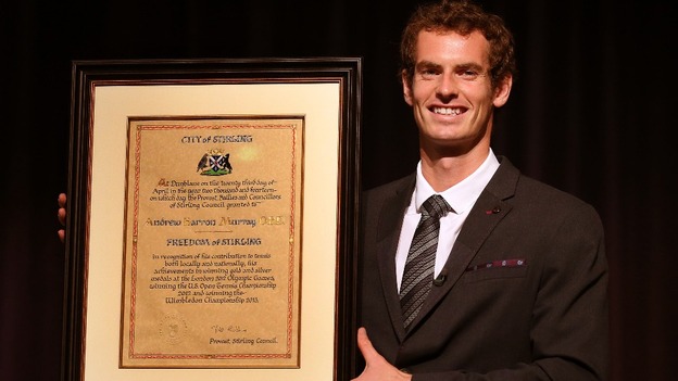 Wimbledon champion Andy Murray smiles widely as he holds the Freedom of Stirling.