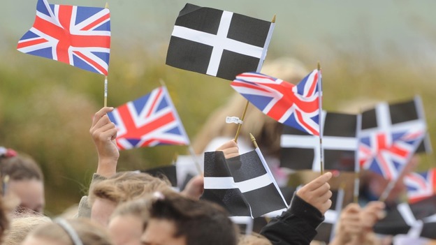 Cornish and Union flags are waved side-by-side.