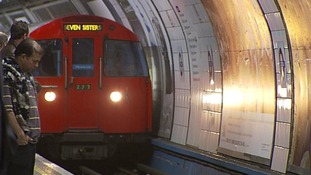 A tube train entering a station.
