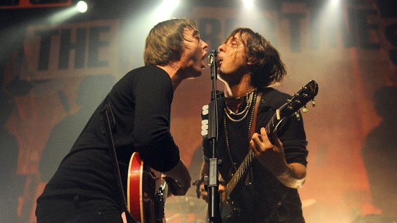 Pete Doherty (left) and Carl Barat of the Libertines performing on stage at the HMV Forum in Highgate, London