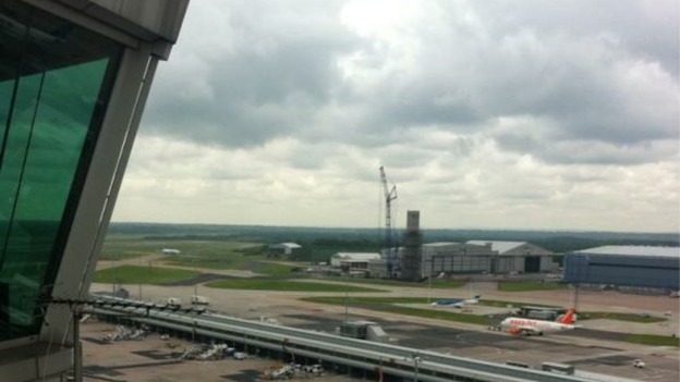 The crane prepares to move the top cap