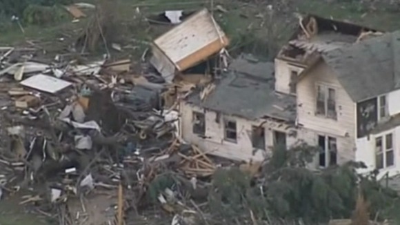 TV footage showing houses ripped off their foundations