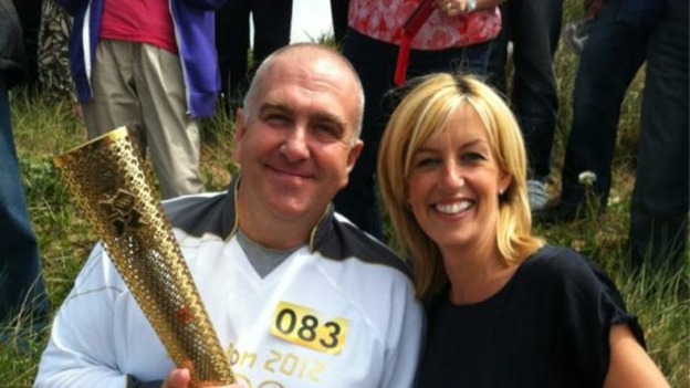 Granada Reports Correspondent Rachel Townsend gets close to the torch in Crosby