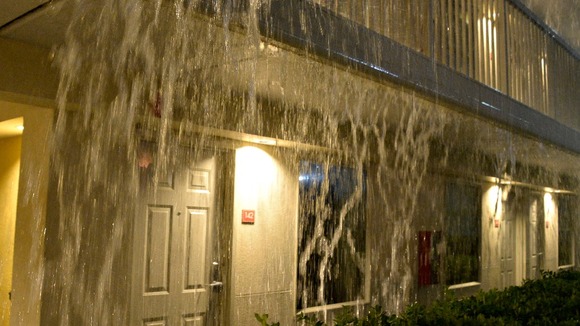 Heavy rain pours like a waterfall during a tornado storm in Tuscaloosa, Alabama.
