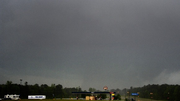 A large tornado is seen crossing the town of Louisville, Mississippi.