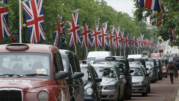 Cars in a queue of traffic.
