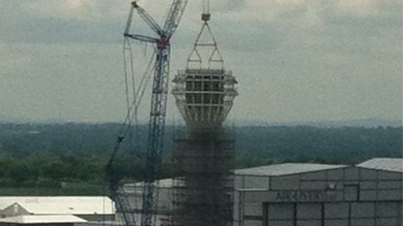 The cap is hoisted into place