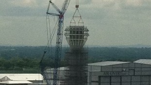 The cap is hoisted into place