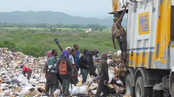 People rummage through rubbish in Riverton - one of the poorest areas in the country.