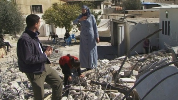 Moran gazes at the pile of rubbish that used to be her family's home.