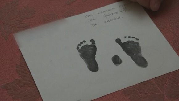 The only keepsake Elaine Joseph has of her daughter Tomika is a card with her footprints.