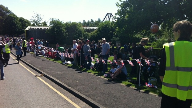Crowds line the pavements as the torch arrives at Knowsley Safari Park