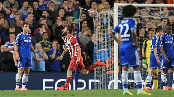 Chelsea fans watch on as Atletico celebrate their second goal.
