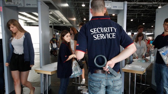 Security guards check the bags of applicants for the study of medicine at Vienna University.