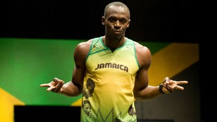 Jamaican sprinter Usain Bolt wearing the 2012 Jamaican Olympic kit during a photocall at Village Underground in London.