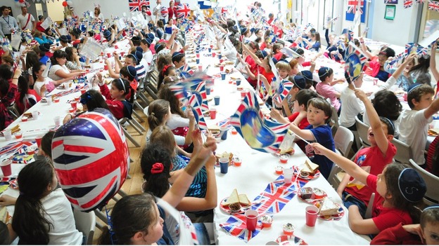 Pupils waving flags