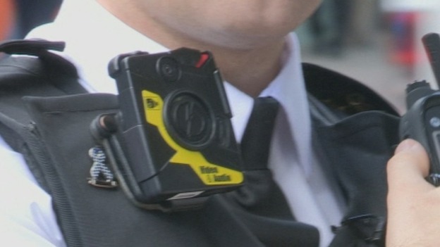 An officer wearing a bodycam video camera.