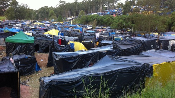 'Squatter camp' for families who say they have been forced from their homes because the redevelopment has made rental prices surge.