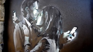 The Banksy artwork Mobile Lovers was removed from a wall in Bristol and taken to the youth club.