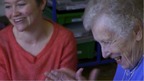 old lady with grown up grandaughter laughing