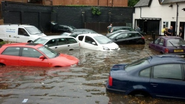 Cars left floating in a pub car park after the floods