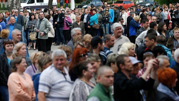 Voters queue up to cast their ballot in Mariupol.